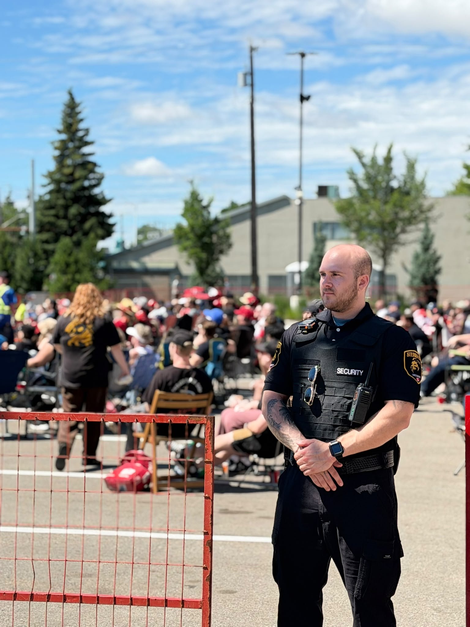 Sierra 13 Security guard managing crowd safety at a large public event